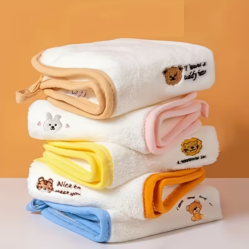 A set of 5 ultra-soft coral fleece towels decorated with cute animal patterns.